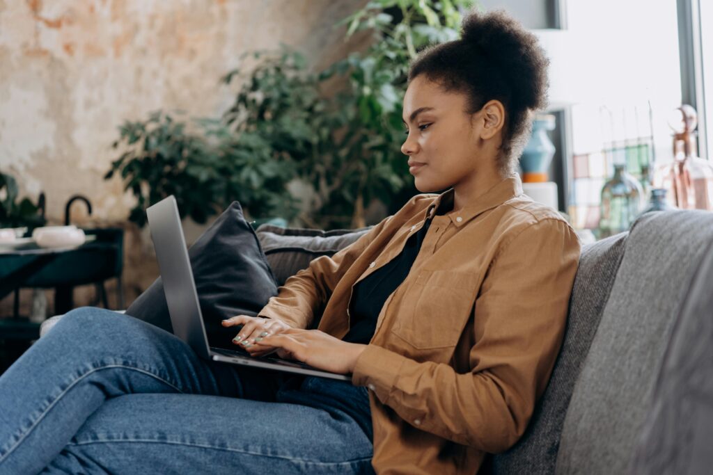 A woman reading a blog by Filip Dorić and learning why payment processors matter for her online business.